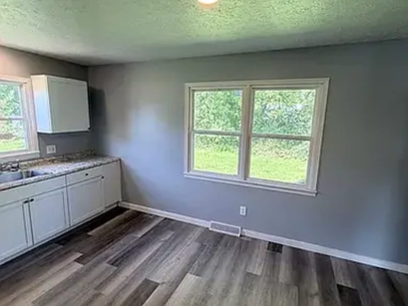 Kitchen with white cabinetry in a Yoak Properties home