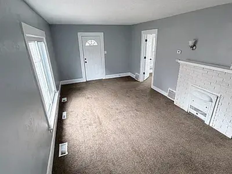 Living room with an original fireplace